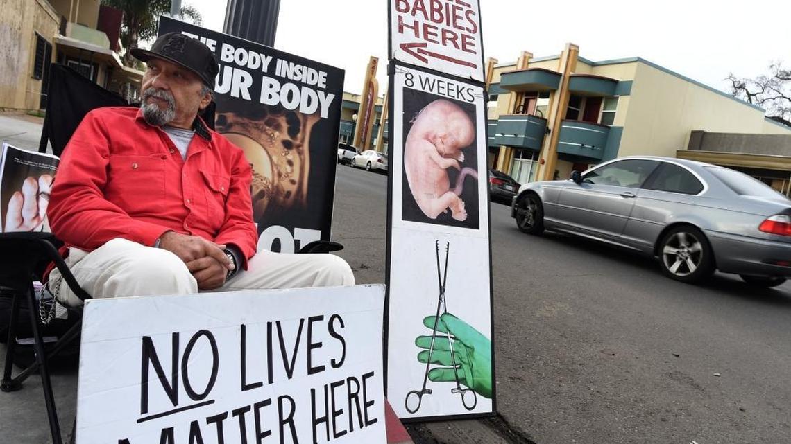 Daniel Perez watches for out for potential Planned Parenthood clients in hopes of dissuading them from using services at the clinic on Fulton Street near downtown Fresno in this 2017 file photo.