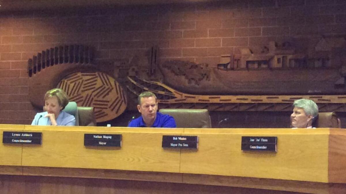 Council members Lynne Ashbeck, left, and Bob Whalen, right, listen to Mayor Nathan Magsig Monday while discussing a personnel commission appointment.