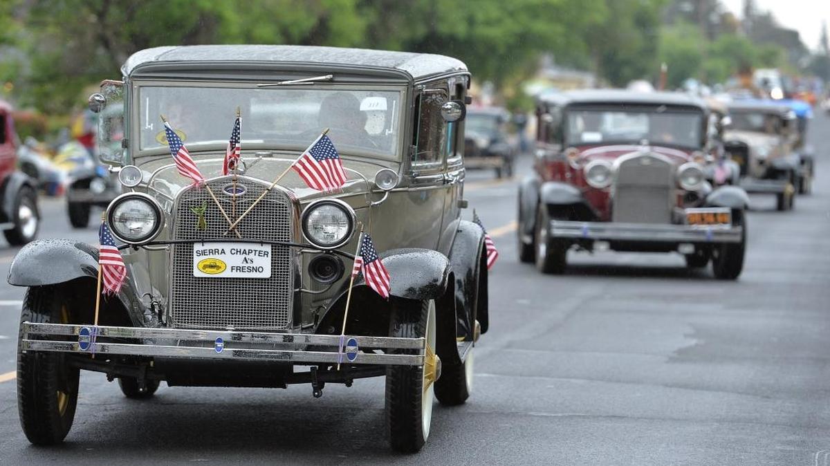 Model A Ford Club of America Sierra Chapter cars participate in the 2015 Clovis Rodeo parade. Annual Parade in Old Town Clovis, California on April 25, 2015. Rain fell during the parade but it didn't stop the festivities.