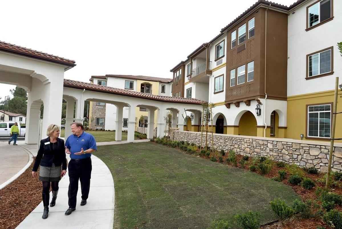 Ren Ramshaw, director of sales and marketing for The Vineyards, and Dennis Bacopulos, The Vineyards developer, stroll the grounds of the senior living community that’s a $42 million expansion of the California Armenian Home.