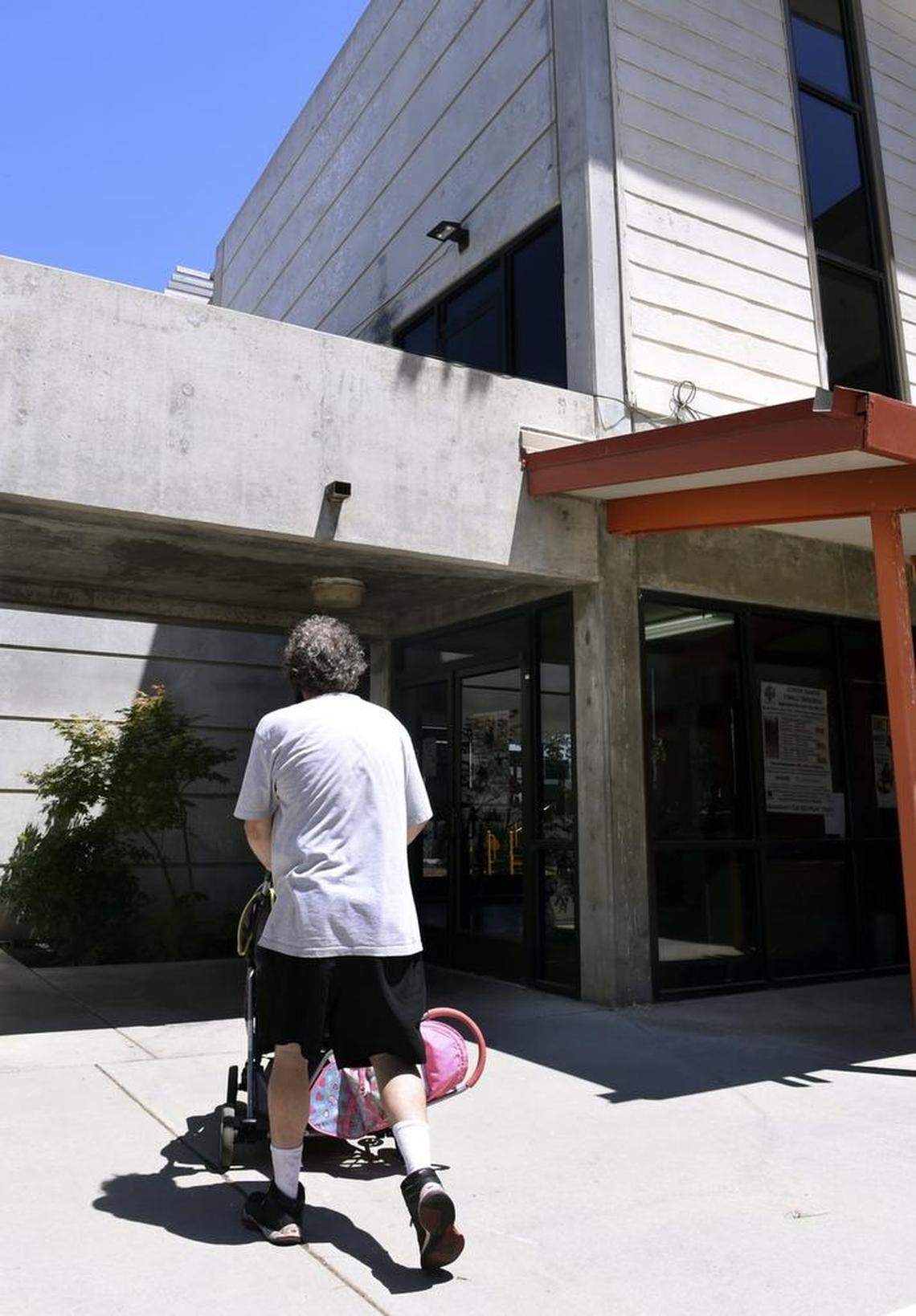 A man walks into the Pinedale Community Center cooling center on a hot summer day.