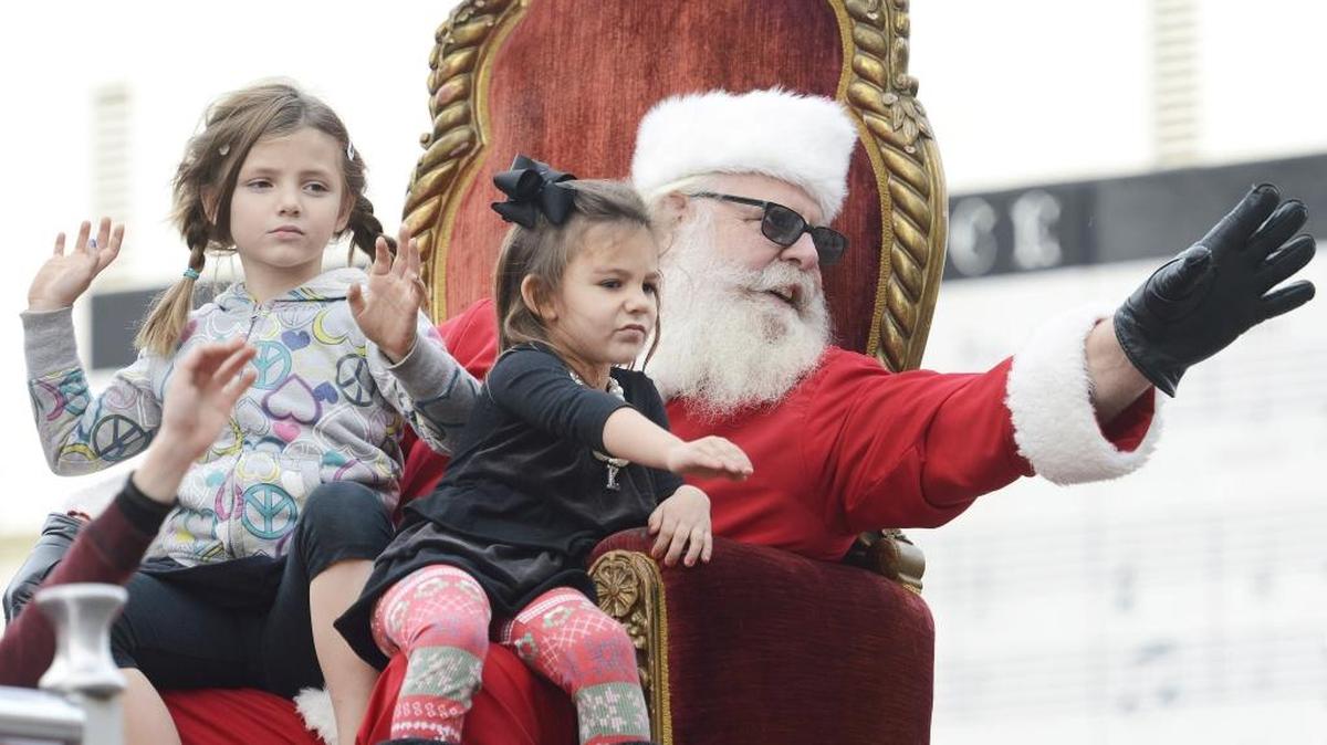 Santa, joined by a few friends, waves from a fire truck as they conclude the 2015 Downtown Fresno Christmas Parade. CRAIG KOHLRUSS/THE FRESNO BEE The 87th annual parade is Dec. 3, 2016.