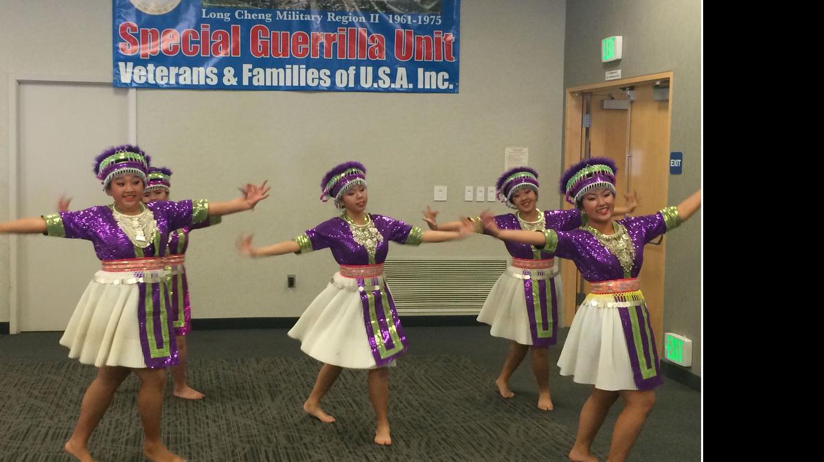 
Traditional Hmong dancers perform during a reconciliation ceremony Sunday between the Hmong community and the U.S. Attorney’s Office. 
