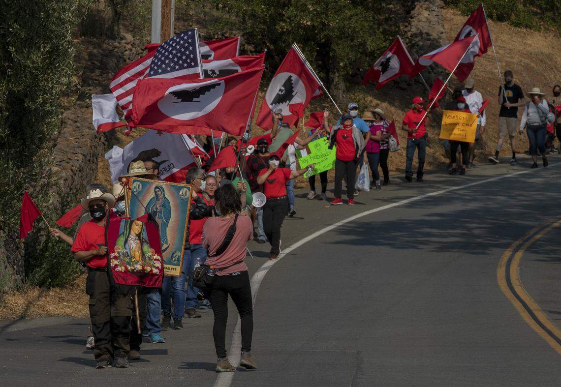 Protestors march toward PlumpJack Winery, owned by Gov. Gavin Newsom, in response to the governor’s veto of AB 616 on Sept. 25, 2021 in Yountville, CA. Photo by Rahul Lal for CalMatters