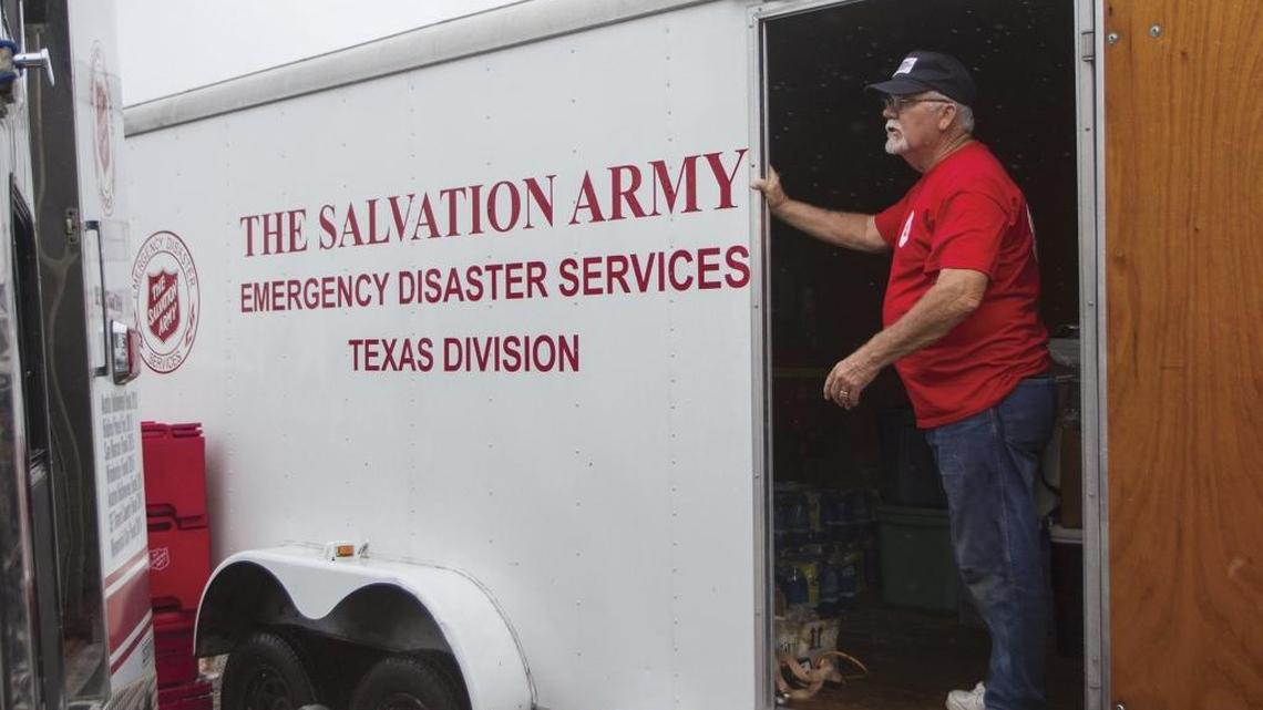 Bruce Peterson of Austin, Texas, stands inside a cargo trailer containing relief supplies brought by the Salvation Army to Seadrift, Texas, to help provide aid for Hurricane Harvey victims on Monday, Aug. 28, 2017.