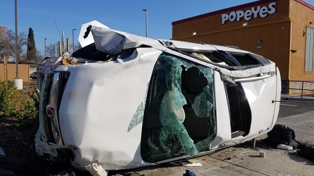 An SUV flipped Sunday, Jan. 28, 2018 on Blackstone Avenue in Fresno, California slamming into a pole on the sidewalk and injuring the two people inside, police said.