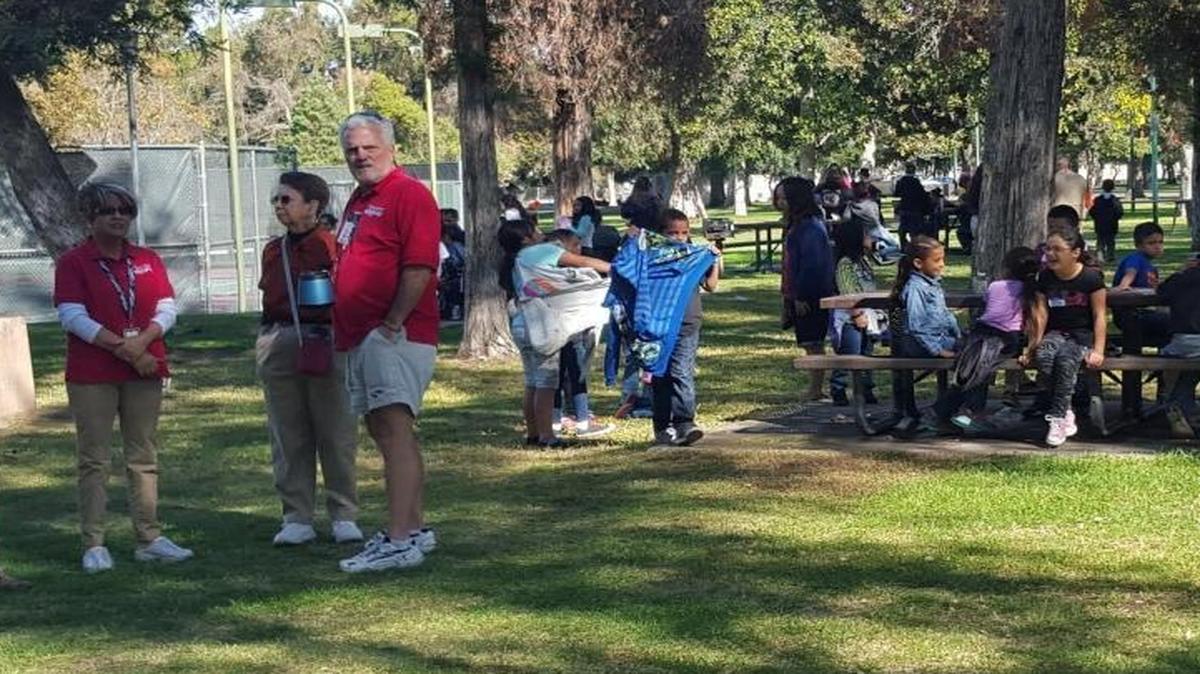Visitors to Fresno Chaffee Zoo wait outside the gates following an evacuation due to a gas leak.