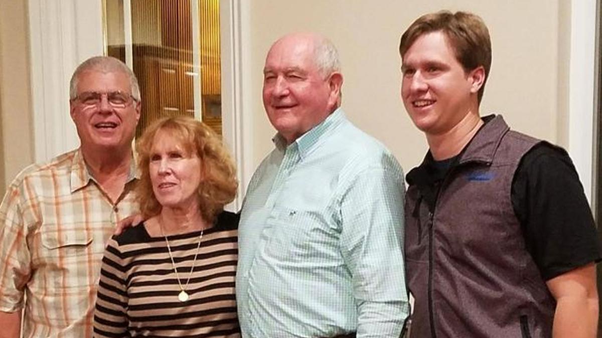 U.S. secretary of Agriculture Sonny Perdue, center right, poses for a photo with Mark Cavallero, right, and his parents Kerin and Jim Cavallero, left, after touring the Cavallero Farm on Sunday, Nov. 5, 2017.