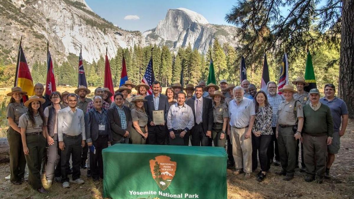 Yosemite National Park officials gather to sign partnership with parks in Mexico, Australia and Jordan.
