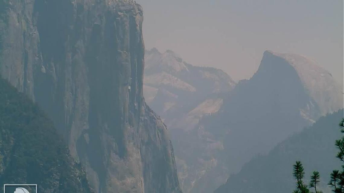 The view of El Capitan and Half Dome in hazy conditions Thursday. Smoke from the Detwiler Fire in Mariposa County has rolled into Yosemite Valley.