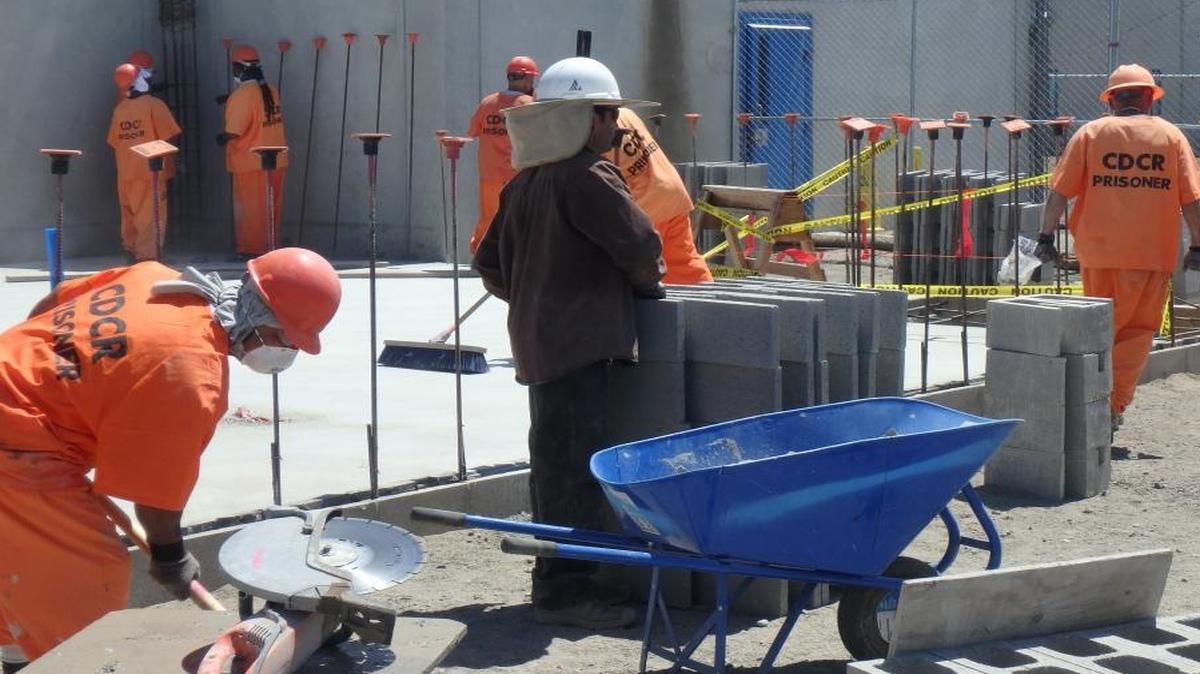 Prisoners work on a new health clinic under construction inside Corcoran State Prison.