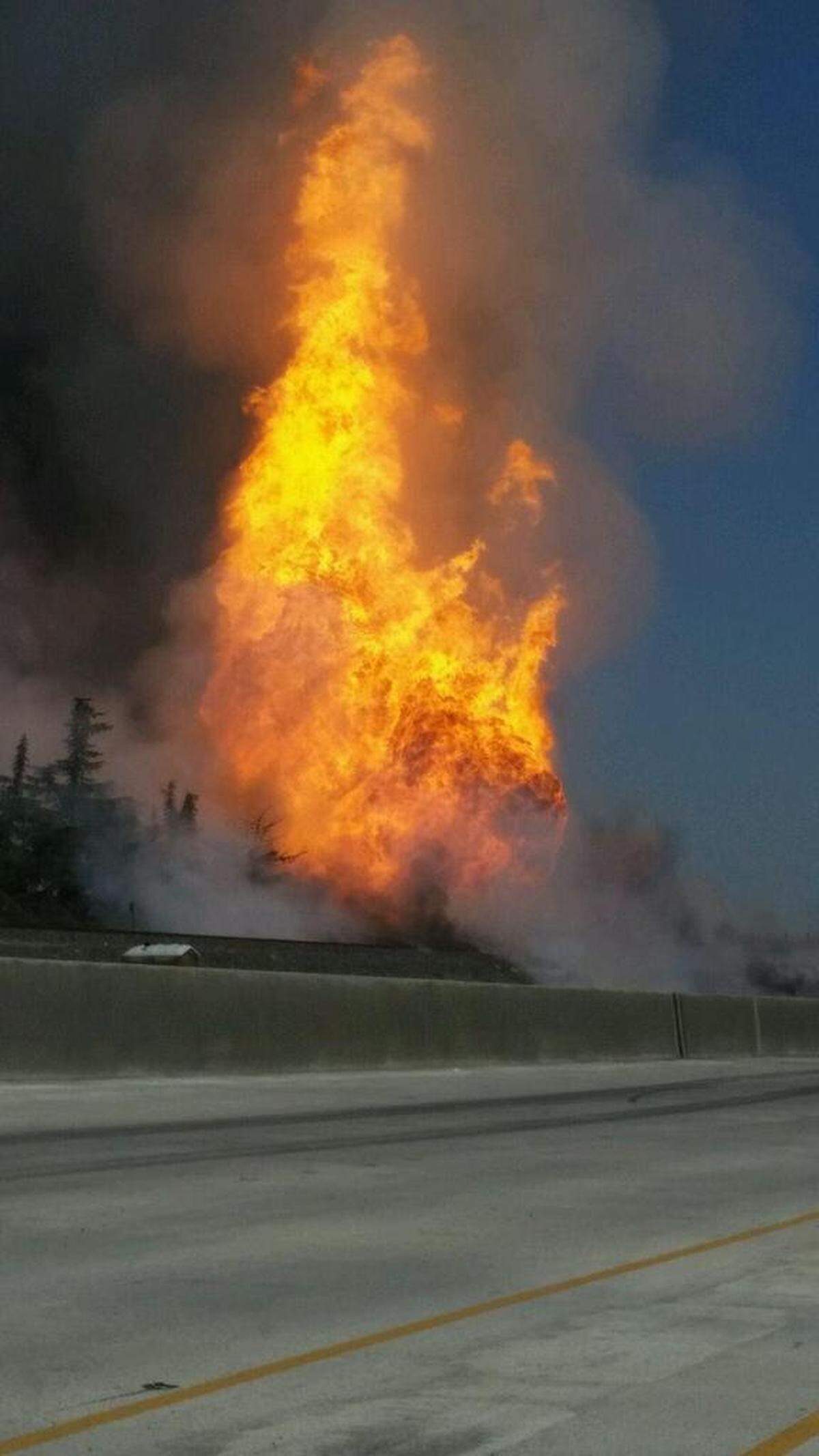 A gas line rupture caused a fireball that closed Highway 99 in north Fresno.