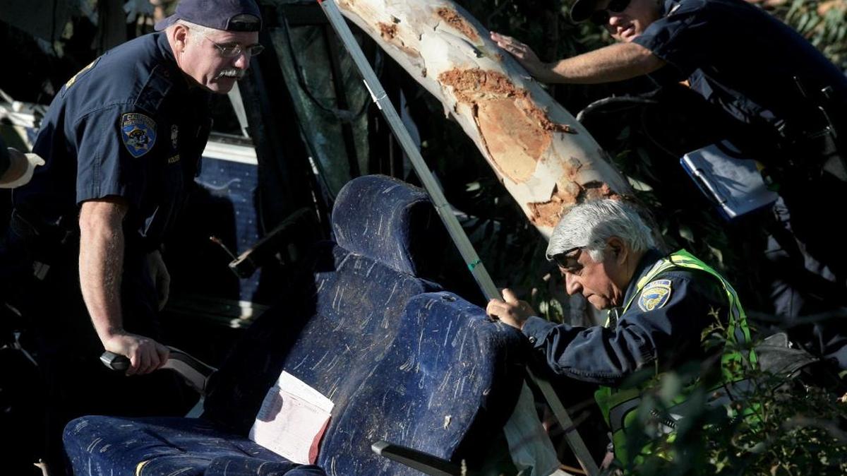 California Highway Patrol investigators look over seats from the July 22, 2010 Greyhound bus crash on Highway 99 in central Fresno in which six people were killed. The special investigators are critical to reconstructing what went wrong to cause a crash.
