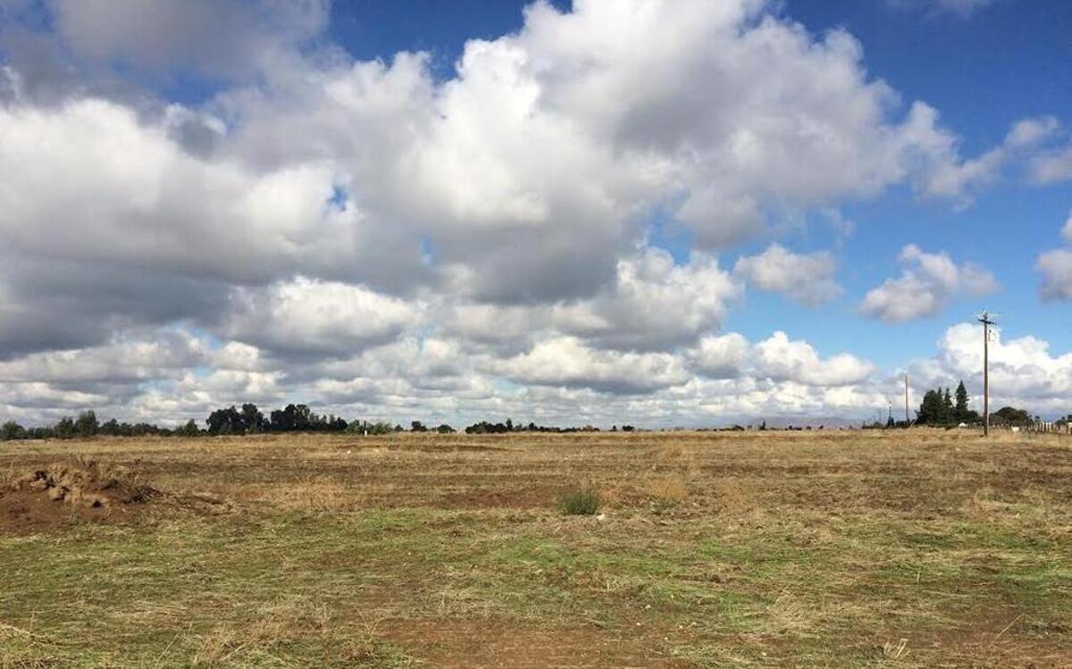 Land in the Southeast Development Area proposed for a Clovis Unified School District educational center near Highland and Clinton avenues.
