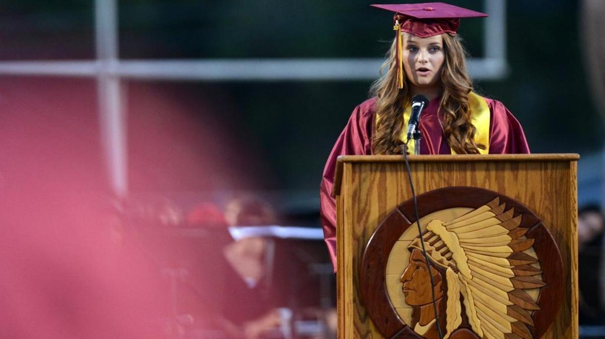 Tulare Union High School valedictorian Allison Ross gives her speech during the school’s 120th graduation ceremony in 2013. The Redskins symbol will have to give way due to a state law that forbids use of the Redskins as a team name and school mascot.