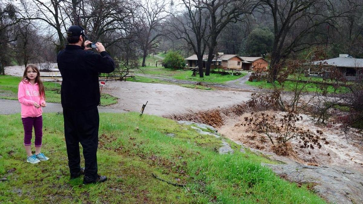 A small roadway is covered over with water from a flooded creek in Coarsegold following heavy rain on Feb. 7, 2017. A new series of storms is headed toward the Valley later this week, and could trigger more flooding and mudslides, the National Weather Service said.