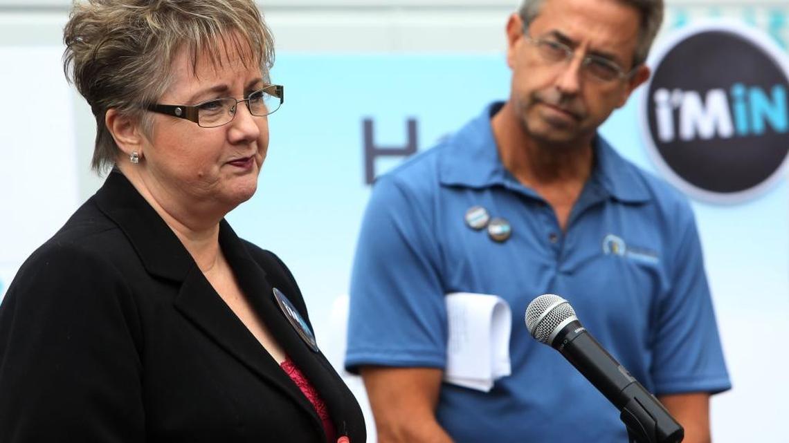 Diana Parret, of Fresno, pictured in 2014 with Covered California Executive Director Peter Lee. Parret bought Kaiser insurance three years ago and stayed with Kaiser when her income decreased and she was eligible for Medi-Cal. Now she now has to find doctors by Sept. 1 when Kaiser’s Medi-Cal contract with CalViva ends.
