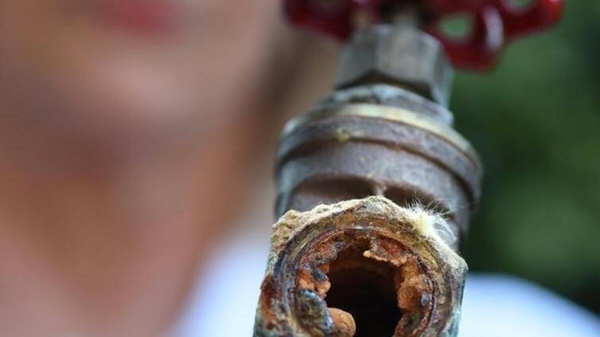 Northeast Fresno resident Karen Micheli shows an example of the rusted interior of galvanized pipes in her home in this June 2016 file photo. Micheli is among hundreds of northeast Fresno residents reporting discolored water coming from household faucets, and one of several dozen where the water also tested positive for lead contamination.