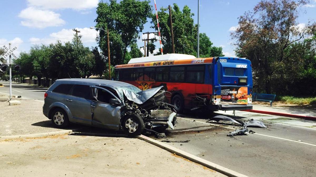 A minivan and a bus at crash scene near Butler and Chestnut avenues in southeast Fresno.