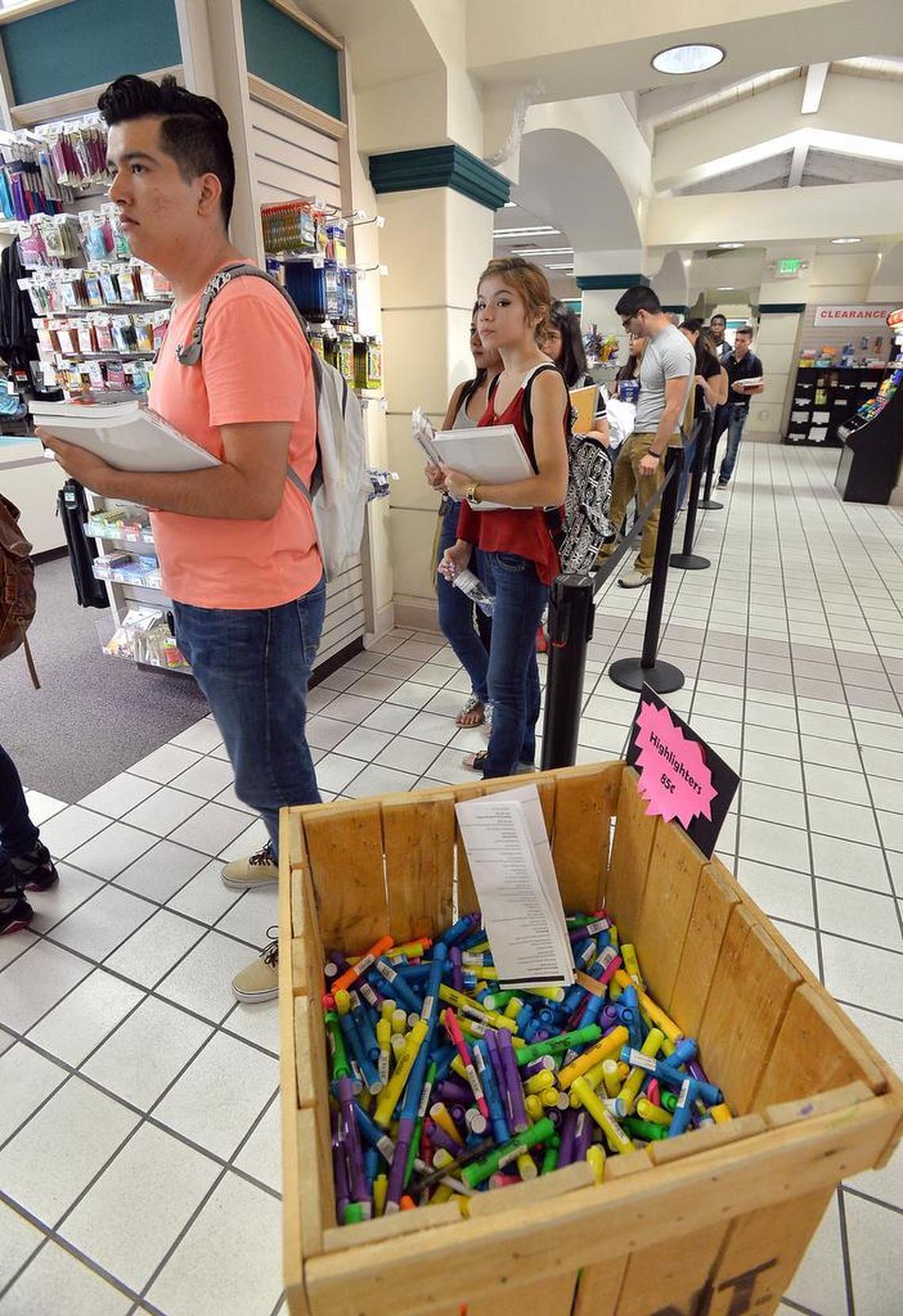 Students stand in line at the bookstore on the first day of the fall semester at Fresno City College in Fresno, California on August 17, 2015.
