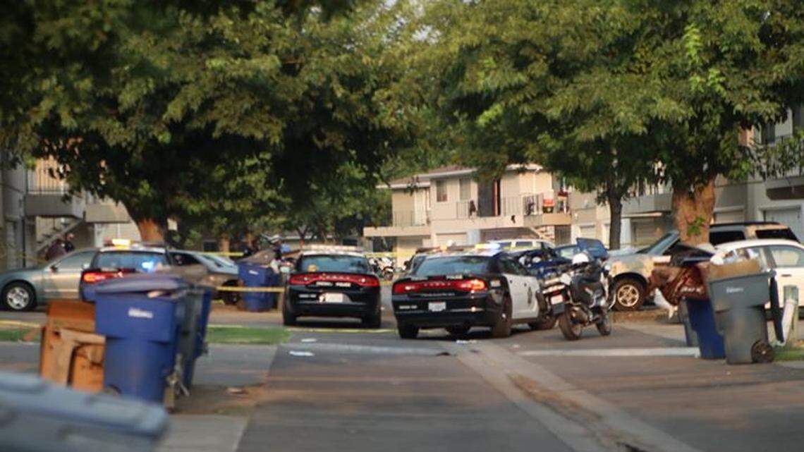 Police respond to the West Shaw Estates, where three people were shot July 30, 2018.