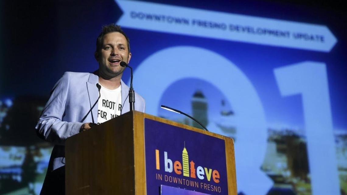 Aaron Blair, chief executive officer and executive director of the Downtown Fresno Partnership, addresses the next speaker during Downtown Fresno Partnership’s first quarter 2016 State of Downtown event held in the Warnors Center for the Performing Arts on Wednesday evening, March 30, 2016 in downtown Fresno, Calif.