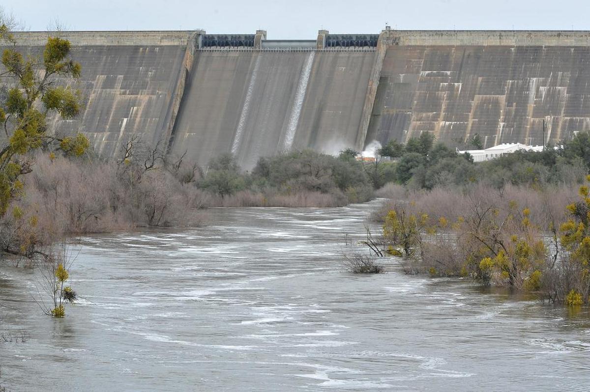 Friant Dam and the San Joaquin River are seen in this Bee file photograph from 2017 when a flood warning had been issued. The river is under another flood watch the weekend of Jan. 14-15, 2023.