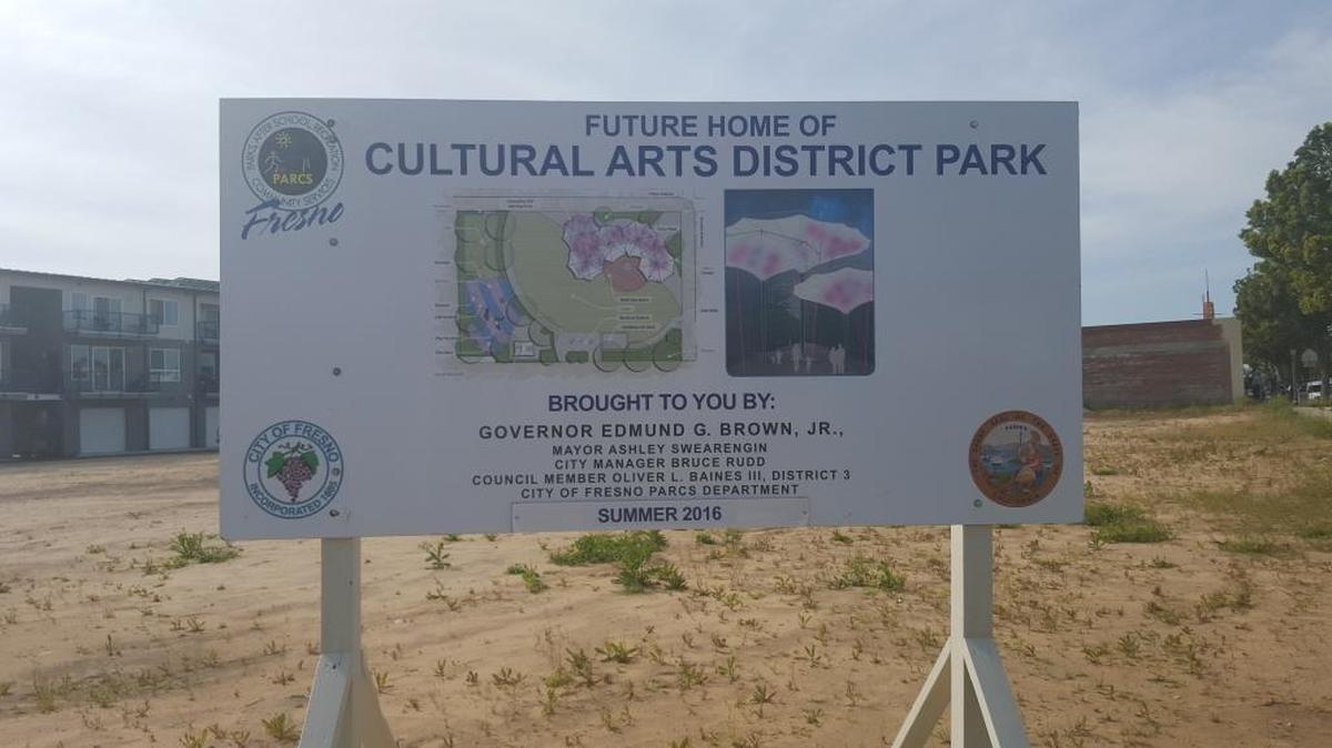 A sign marks the spot of a future park on Fulton and Calaveras streets in downtown Fresno. The completion date has been changed several times.