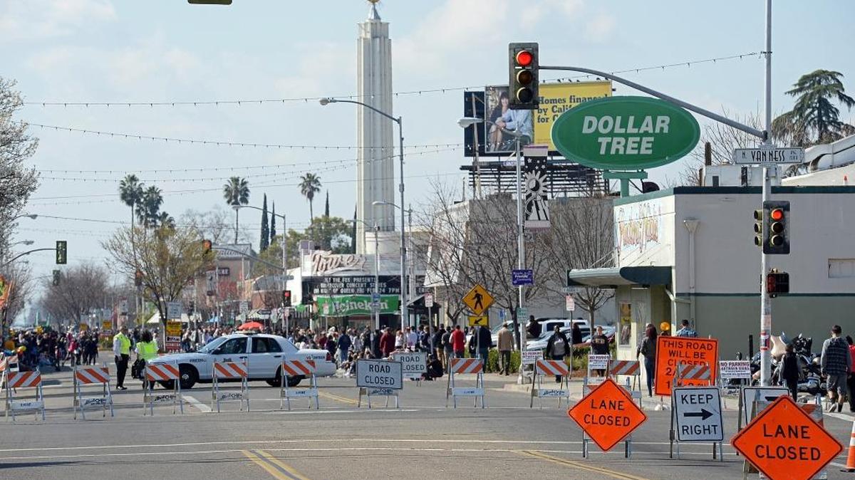 Olive Avenue is closed to traffic prior to the start of the annual Mardi Gras Parade in the Tower District of Fresno in this February 2017 file photo. The Fresno Police Department plans to open a Tower District report-writing office to boost the presence of officers in the neighborhood.