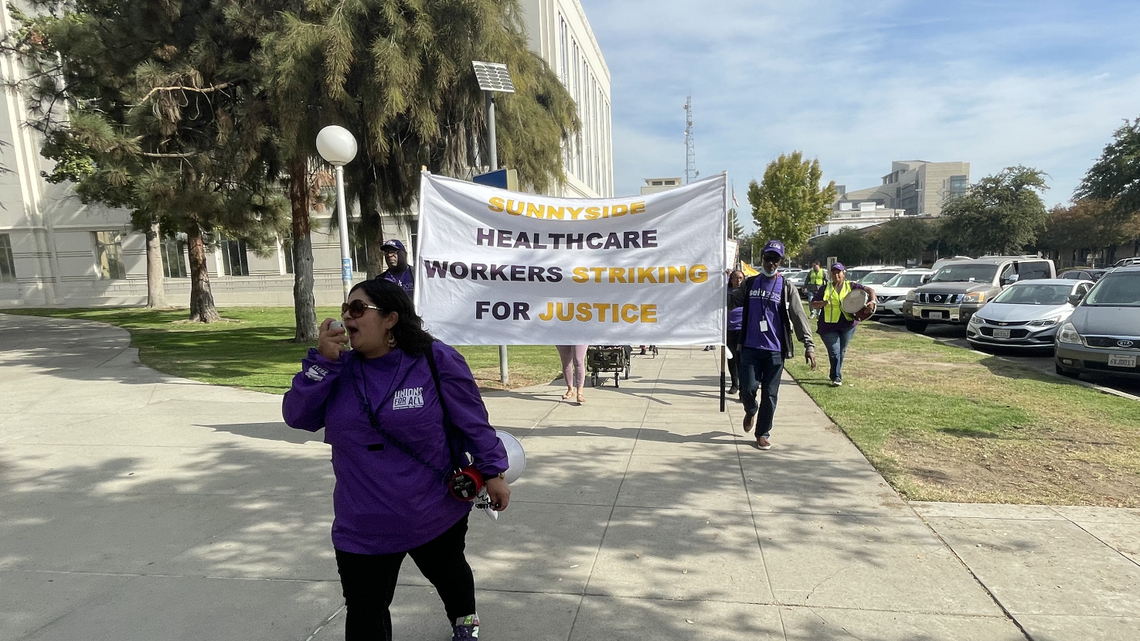 Sunnyside Convalescent Hospital employees and SEIU 2015 union members march in downtown Fresno at Courthouse Park and Tulare Street as part of an ongoing strike and one-day fast on Tuesday, Oct. 18, 2022.