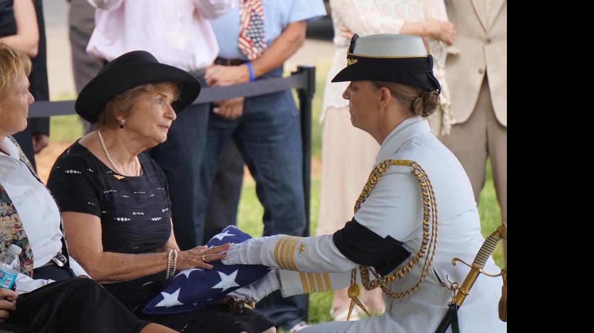 
A member of the Navy Honor Guard gives Stella Leué the American flag at her husband David’s funeral in Arlington, Va., on July. 30, 2015. Stella and David Leué had been married for more than 25 years.
