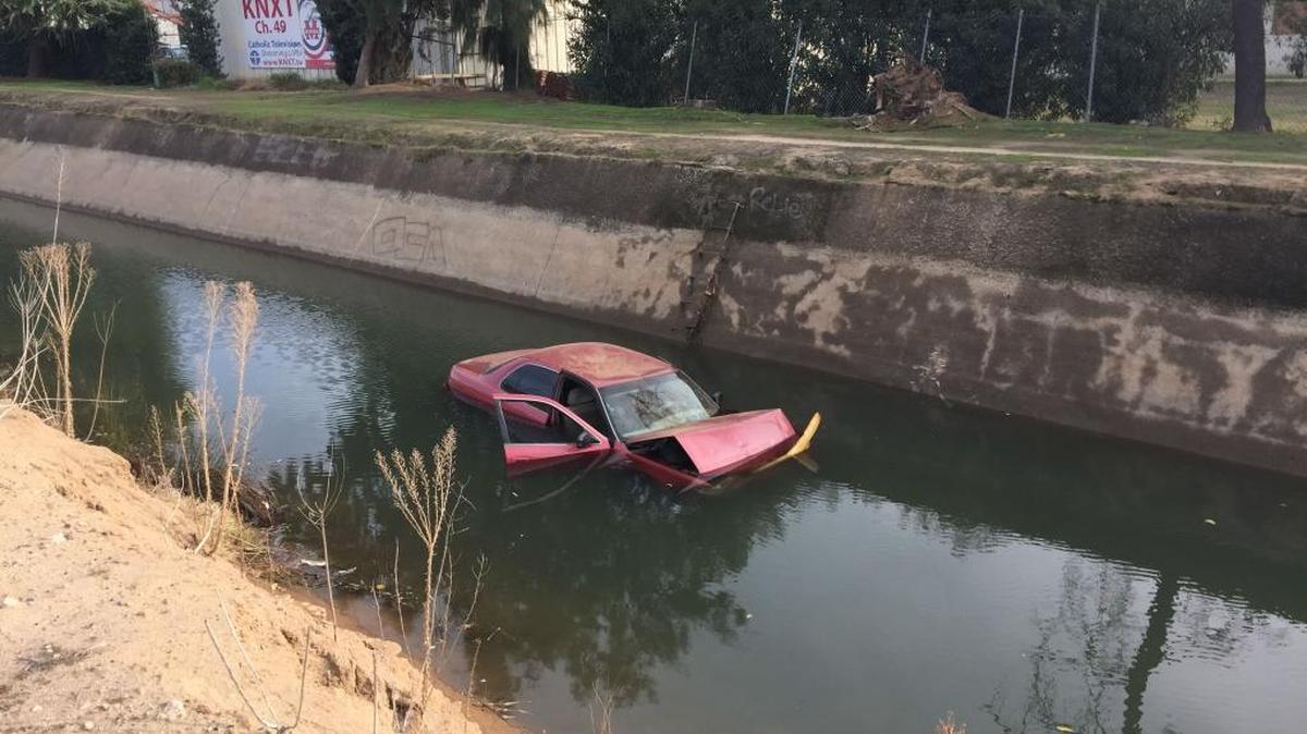 Two Fresno police officers jumped into a water-filled canal to pull a man from his crashed vehicle in central Fresno on Saturday after he careened through a Highway 41 offramp at McKinley Avenue and landed in the canal. The man, in his 50s, broke his forearm in the crash.