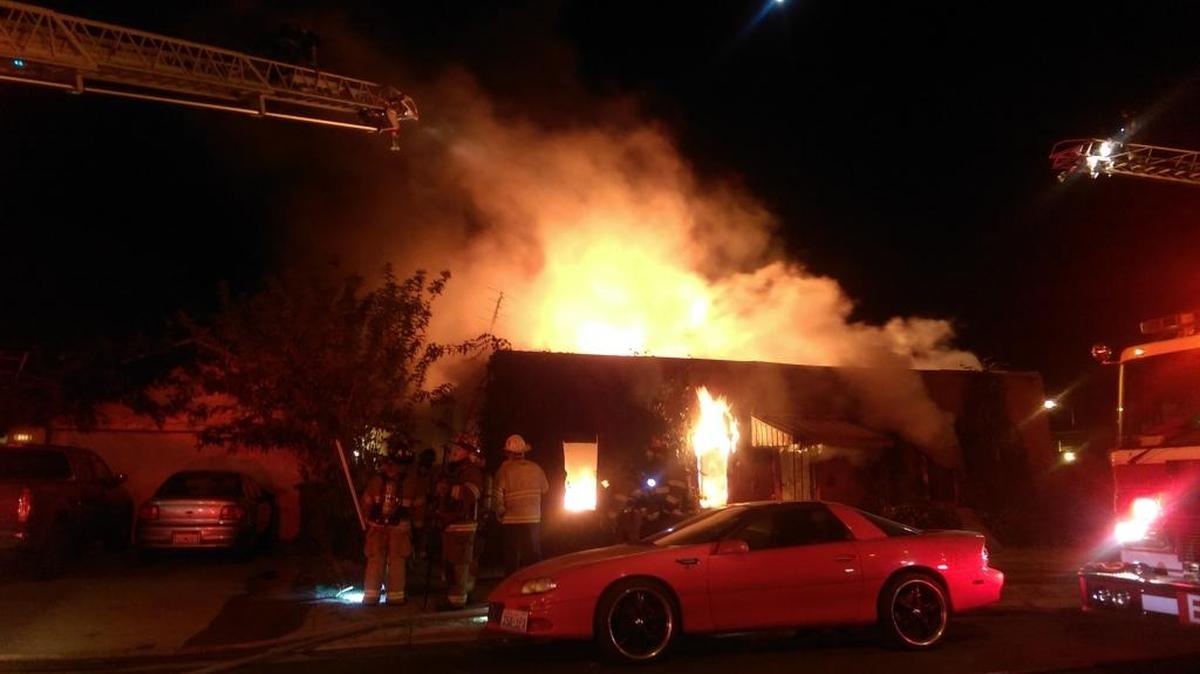 
Fresno firefighters battle flames at an abandoned church building in central Fresno Tuesday night. 

