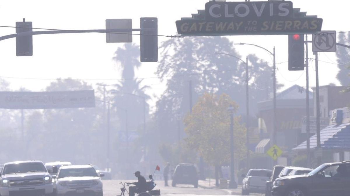 Smoggy days like this one in Old Town Clovis in November 2014 are what the San Joaquin Valley Air Pollution Control District is trying to reduce.