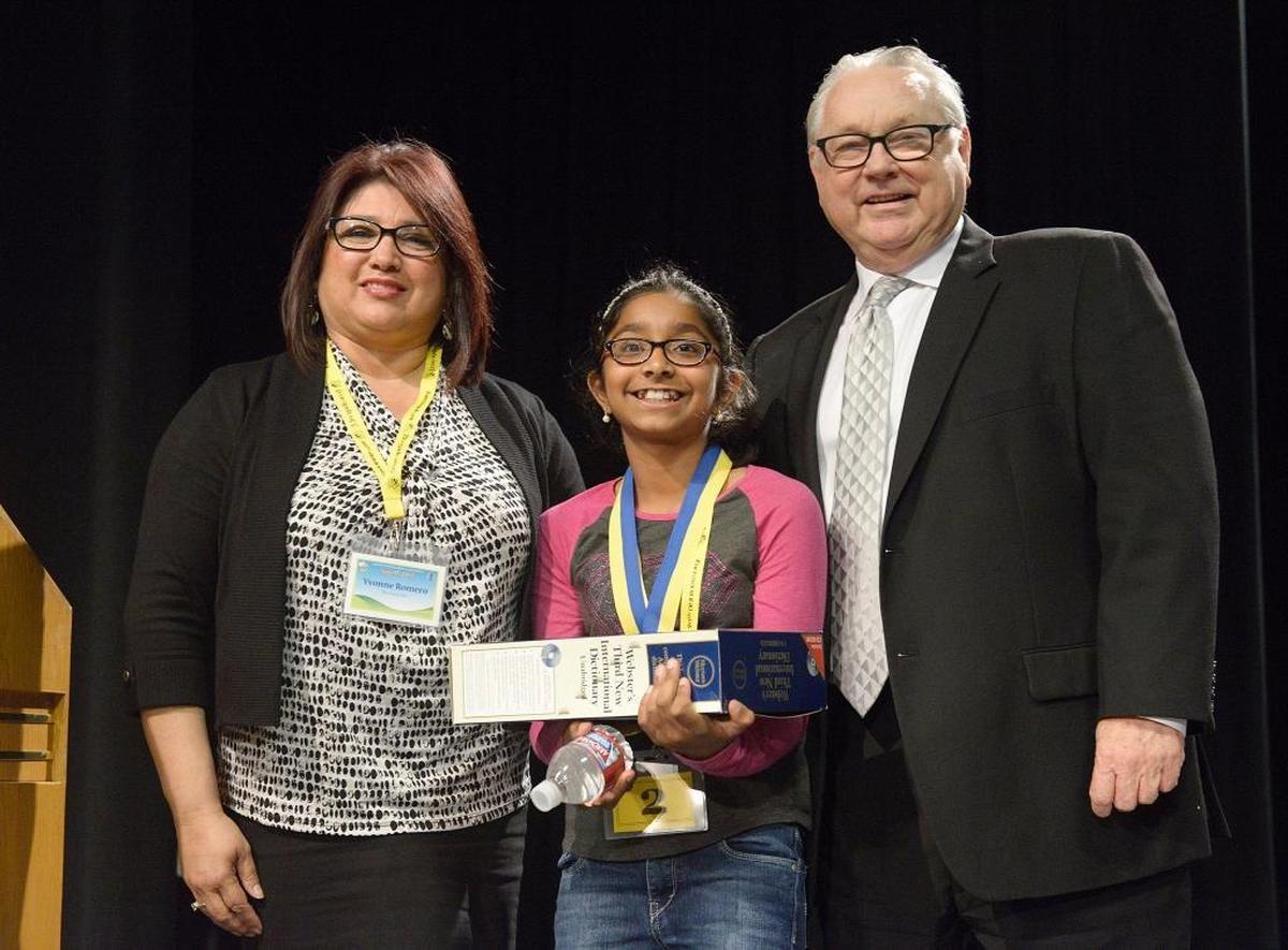 Ananya Vinay, 11, of Fresno with Fresno Bee executive editor Jim Boren and Yvonne Romero, The Bee’s circulation/community relations coordinator, after winning the Fresno County Spell-Off final at Fresno State in March of 2016.