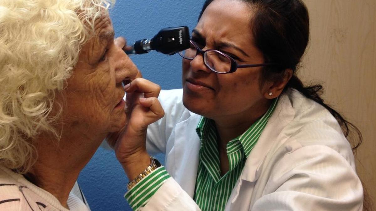 Tahmina Rahman, right, a second year resident, examined Helen Phillips, left, on Wednesday, July 9, 2014 at the Fresno-based Sierra Vista Family Medicine Residency Program, which will end in June. A new Teaching Health Center program at Valley Health Team, scheduled to open July 1 in Fresno, received $2.2 million Wednesday from CalViva Health, a locally governed Medi-Cal managed care plan.