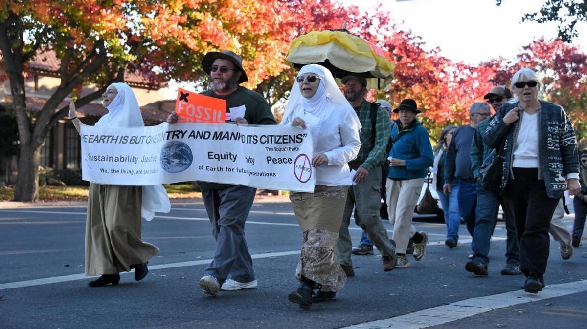 A group of about 40 people marched up and down M Street in Merced Sunday on the eve of the United Nations Climate Change Conference in Paris to raise awareness about a variety of environmental issues.