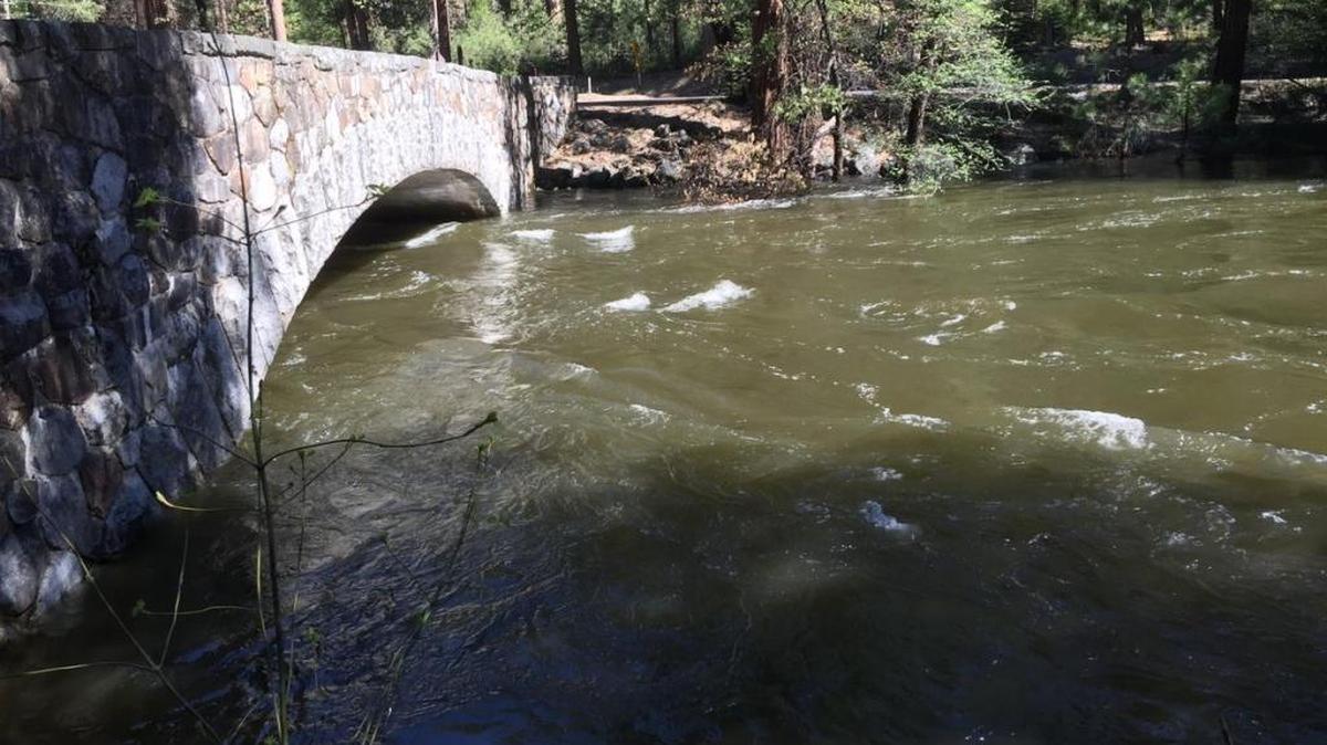 Floodwaters that have risen on the Merced River, shown here at Pohono Bridge, are expected to start dropping later Saturday.