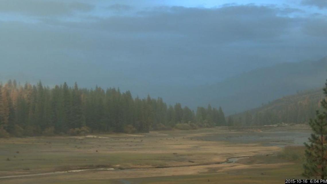 
Hume Lake as it appeared Friday evening. Bare earth is visible where water used to cover. The lake has been drained so repairs can be made to the historic dam, which is in the distance and to the right.
