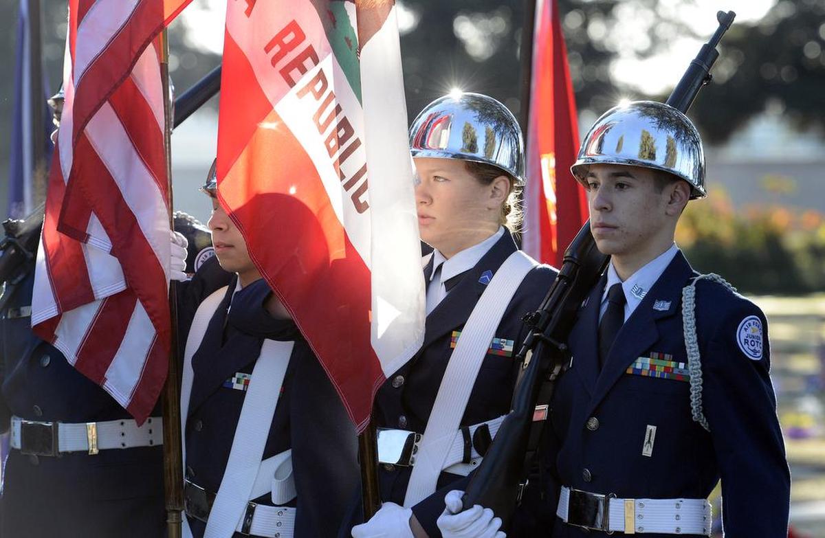 Members of the Clovis East High School JROTC Honor Guard present the colors to begin the annual Wreaths Across America event in 2015.