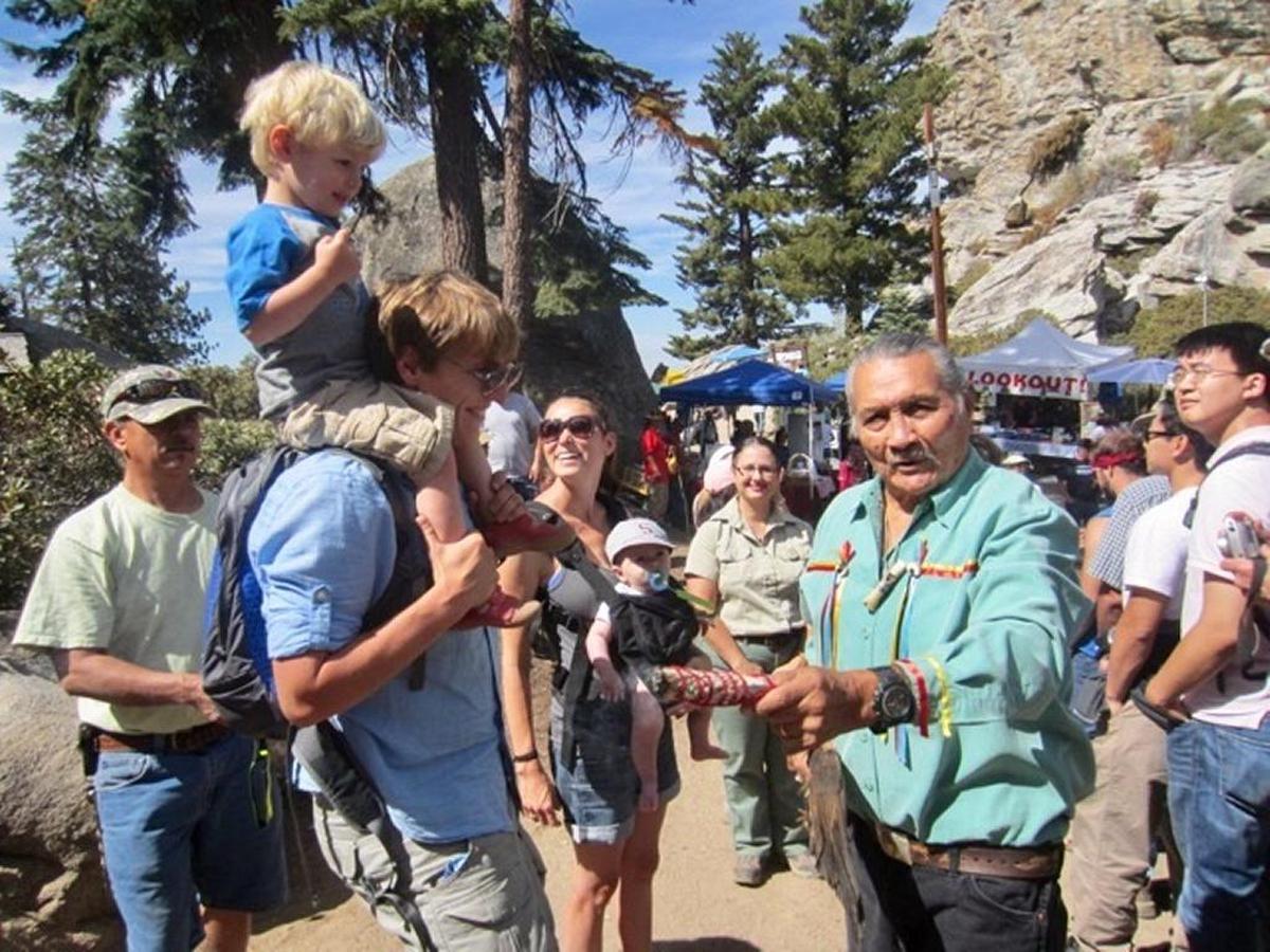 Eddie “Tupishna” Sartuche providing Native American blessings to visitors at the Buck Rock Lookout in Giant Sequoia National Monument.