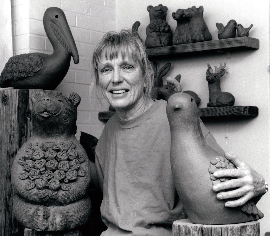 The late Fresno muralist Margaret Hudson is seen with several pieces of her art.