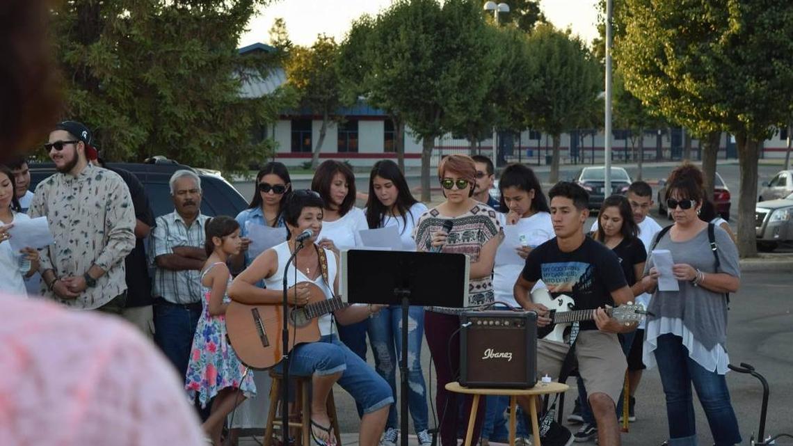 Musicians from St. Mary’s Catholic Church in Sanger performed songs during the vigil for Juanita Davila at Sanger High School on Sept. 11, 2016.