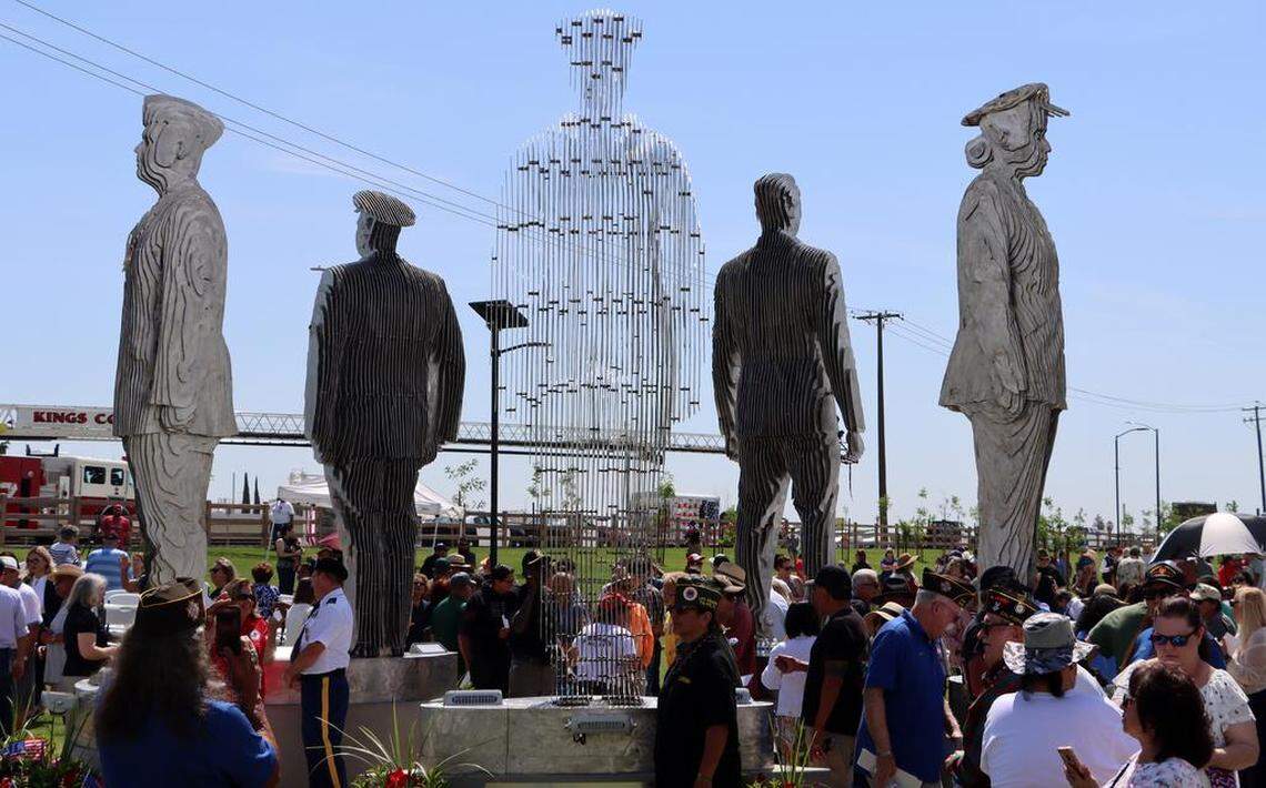 The Five Pillars of Freedom veterans memorial towers over spectators at Gateway Park in Corcoran on April 29, 2023.