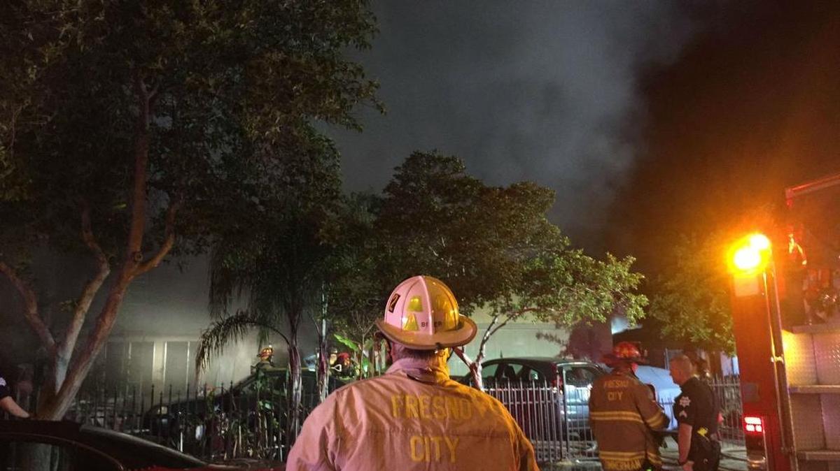 Fresno Fire Battalion Chief Don Bier supervises firefighters attacking a southwest Fresno blaze on Tuesday, May 3, 2016.