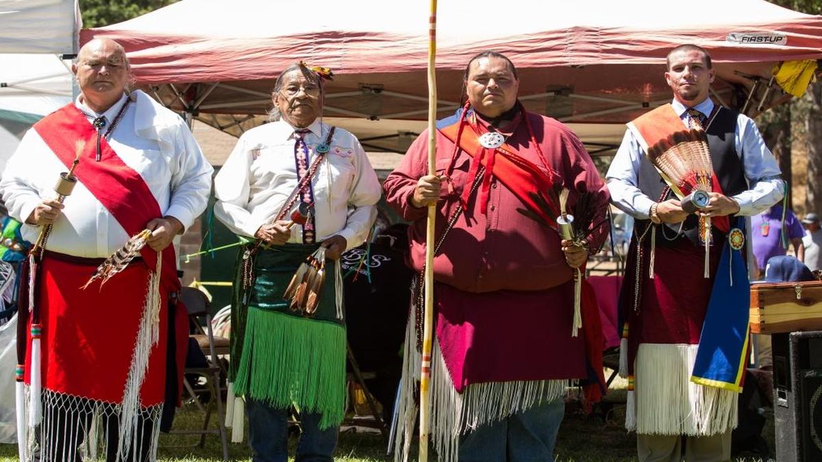 Tribal elders, from left, Bill Elliott, Tommy Chano, Brian Elliott, and Elliott Jures, take part in the open guard cerermony at the Sierra Mono Museum 44th annual Indian Fair Days and Pow Wow held in 2014.