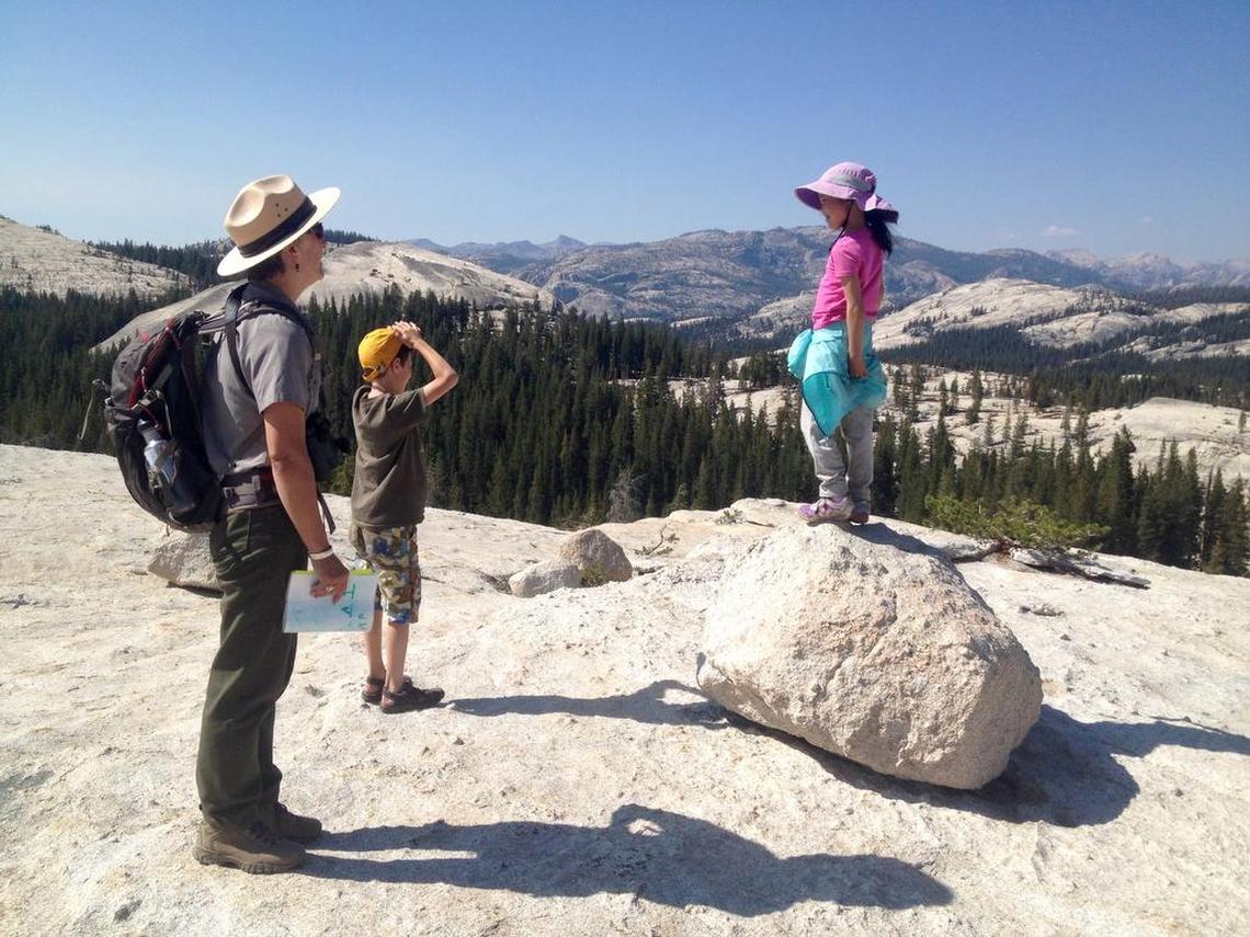 Park ranger Salli Lundgren leads a junior ranger walk on top of Pothole Dome in Yosemite’s Tuolumne Meadows on Thursday, Aug. 25, 2016.