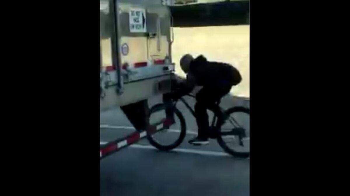 People caught video of a man who was on a bicycle and holding onto the back of a big truck while traveling on Highway 99 on Wednesday. The truck speed limit in the area was 55 mph.