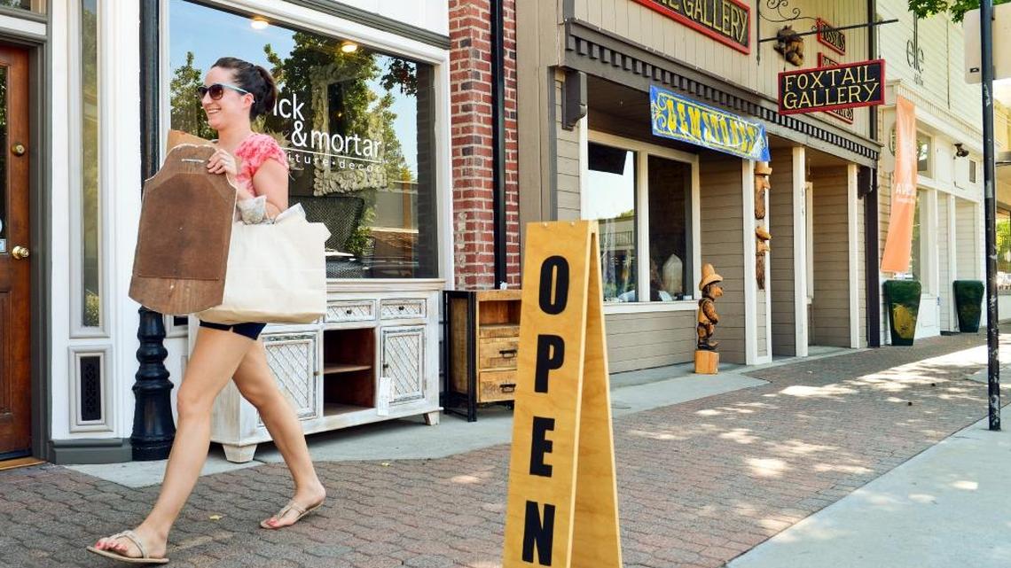 A shopper walks past storefronts in Old Town Clovis in this file photo from 2014. The district is popular shopping spot on Small Business Saturday, which this year happens on Saturday, Nov. 26