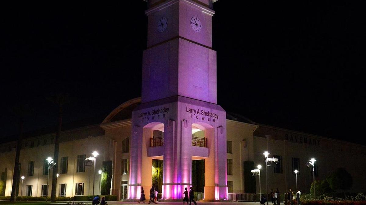 The Larry C. Shehadey Tower at Fresno State’s Save Mart Center is lit up in purple as a tribute to music legend Prince, who performed twice at the center, Thursday, April 21, 2016. Prince died today at the age of 57.